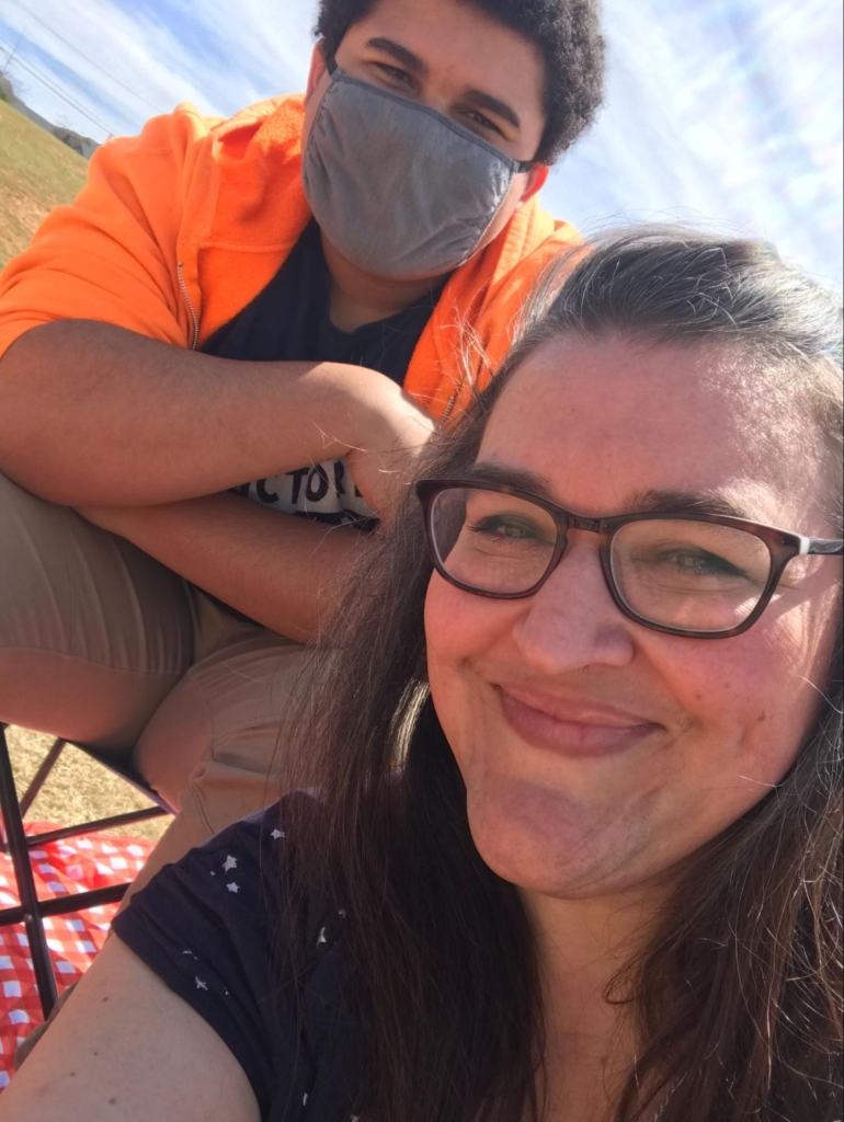 Heather Moore and son Tyler watching a soccer game